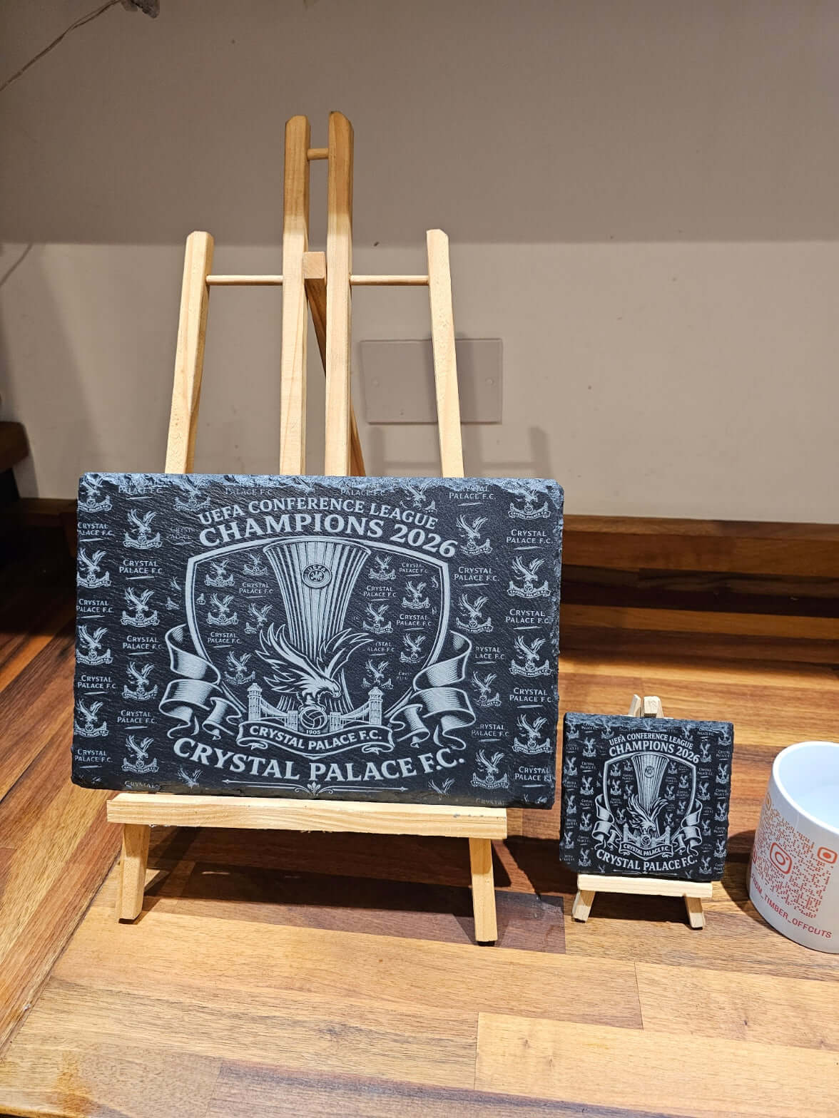 Crystal Palace UEFA Conference League Champions 2026 slate coasters on display, showcasing engraved design.