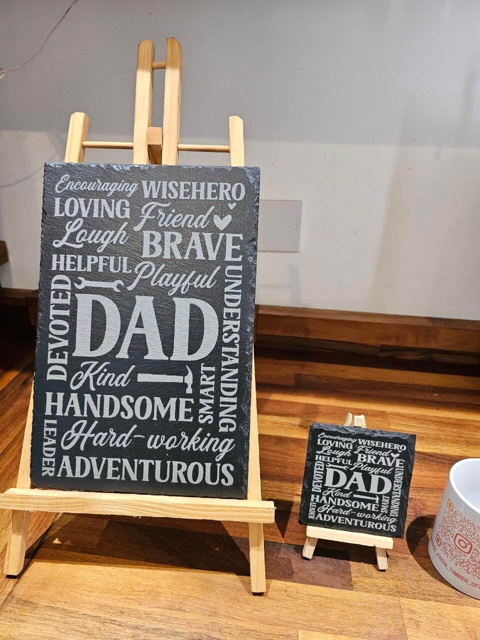 Slate Coasters dad displayed on an easel, featuring the word 'DAD' surrounded by meaningful words, perfect Father's Day gift.
