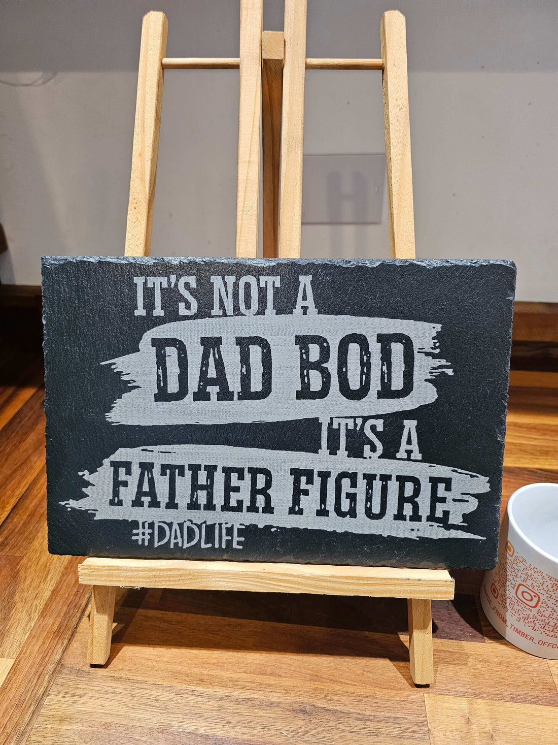 It's Not A Dad Bod It's A Father Figure sign on display for Father's Day Is Fast Approaching.