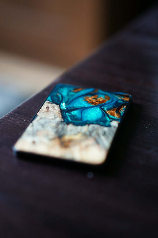 blue and brown stone fragment on brown wooden table