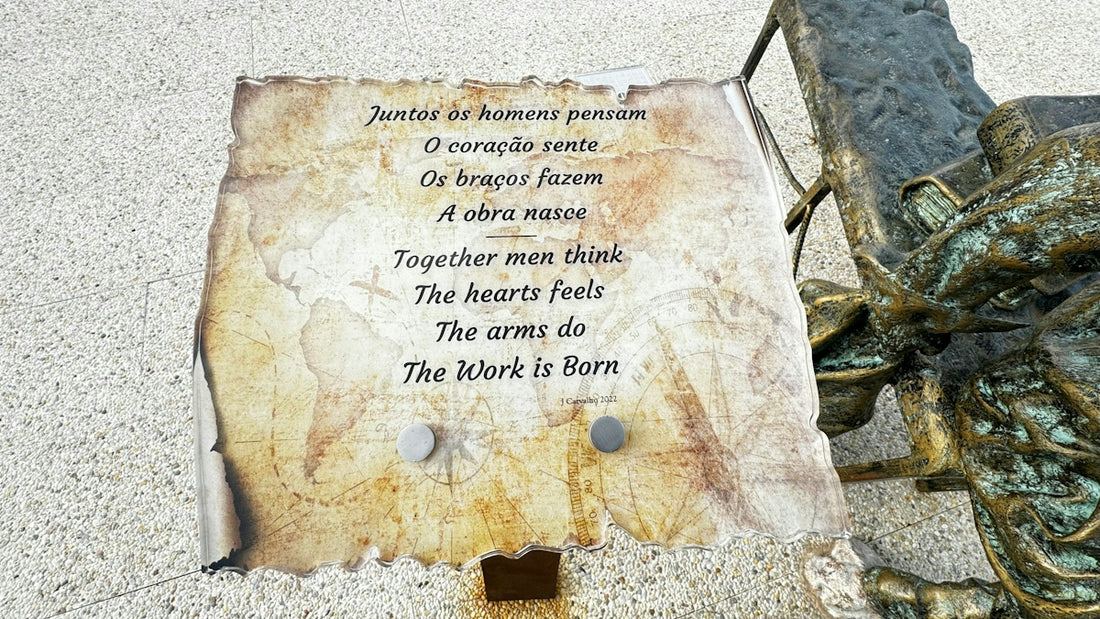 a bronze statue with a poem written on it