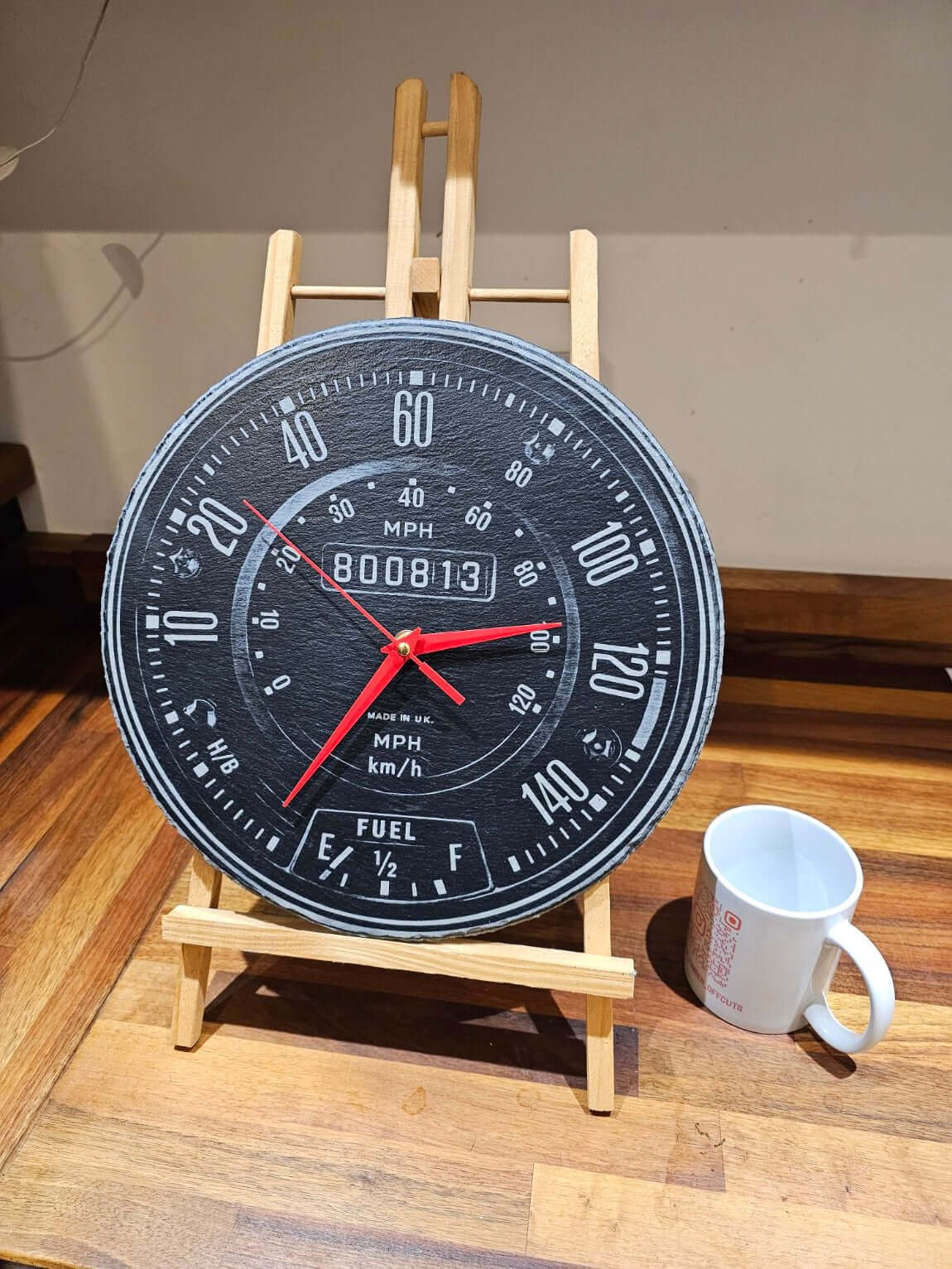 Engraved Slate Clock showcasing a handmade motoring-style design with speedometer layout and bold red hands.