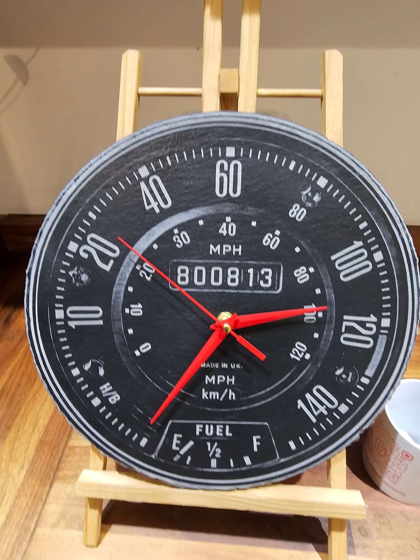 Engraved Slate Clock, 30cm round slate speedometer clock with red hands and automotive design.