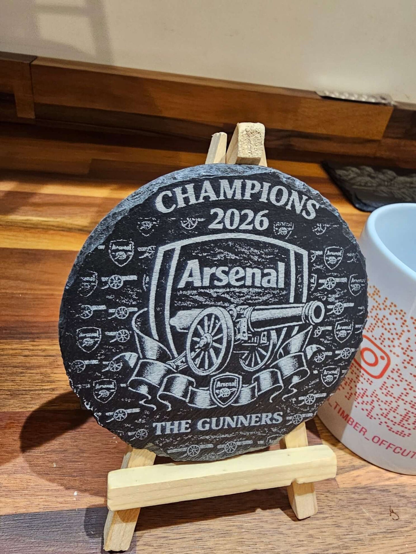 Arsenal Champions 2026 Engraved 300mm Round Slate Plaque Memorabilia showcasing the club emblem and details.