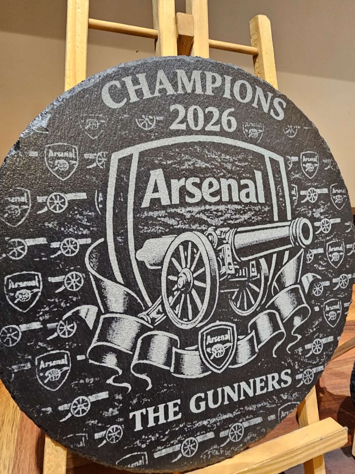 Arsenal Champions 2026 Engraved 300mm Round Slate Plaque Memorabilia with team logo and cannon design.