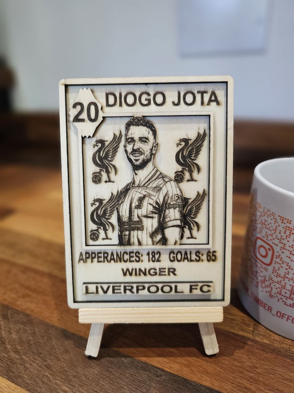 Custom wooden sports card Diogo Jota, featuring his stats and Liverpool FC logo.