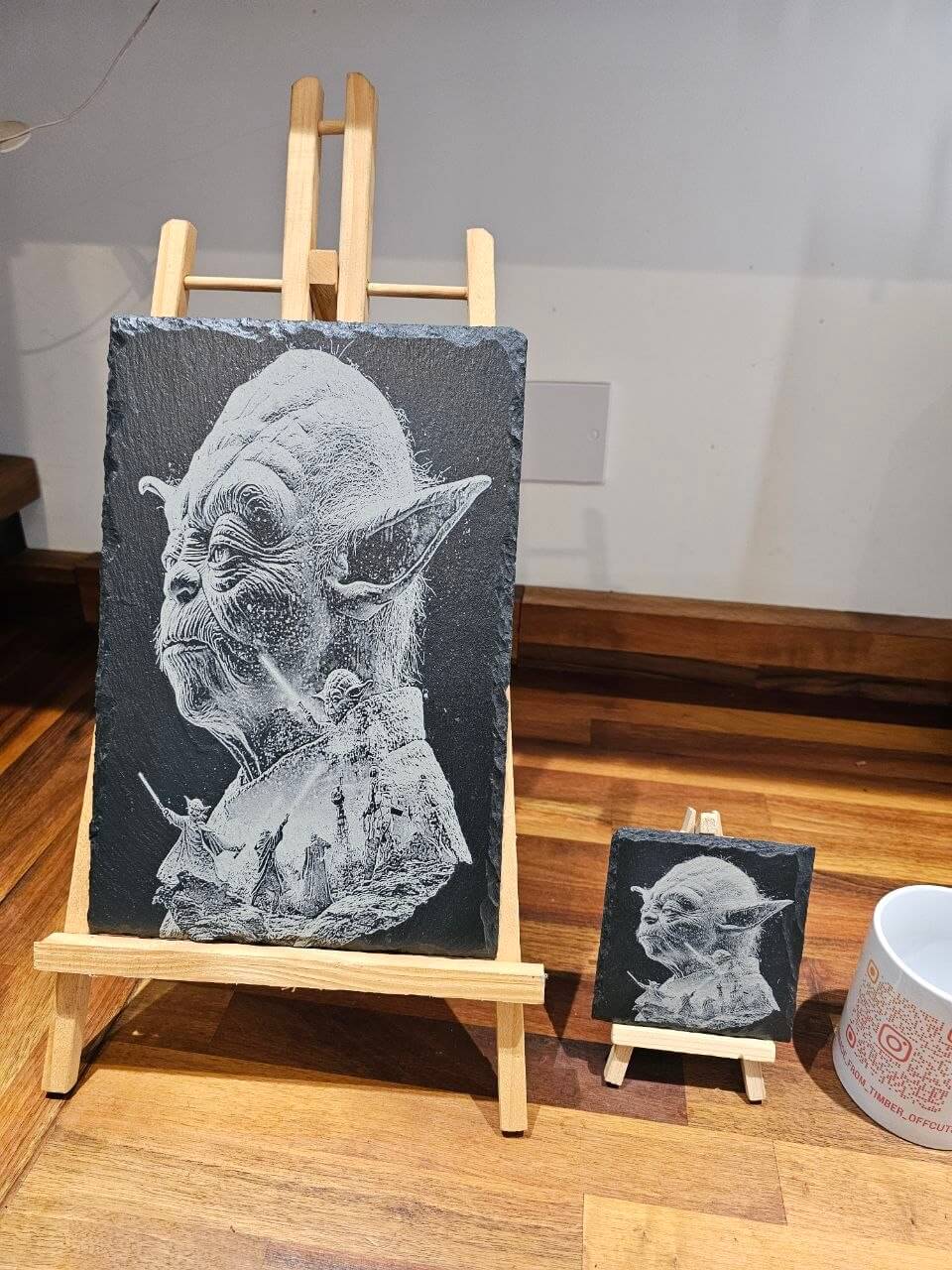 Slate Coasters Yoda laser Engraving displayed on easels showcasing detailed engravings.