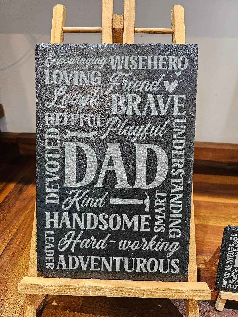 Slate plaque Dad with engraved words describing qualities like Brave, Kind, and Loving, perfect for Father's Day.