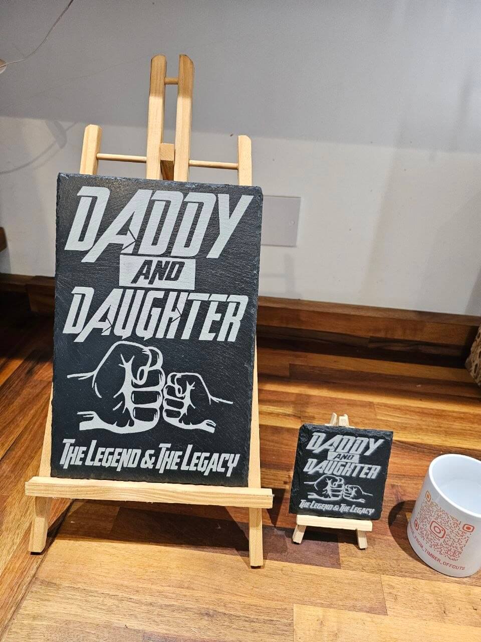 Slate plaque Dad featuring the phrase 'Daddy and Daughter – The Legend & The Legacy' on a wooden easel.