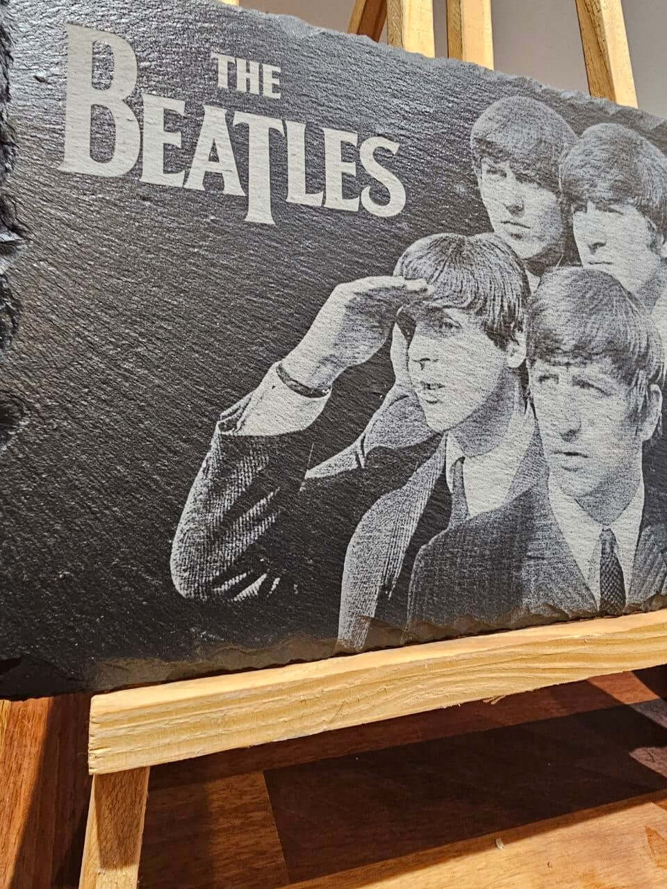 Slate plaque featuring an engraved tribute to The Beatles with classic portraits, perfect for music lovers.