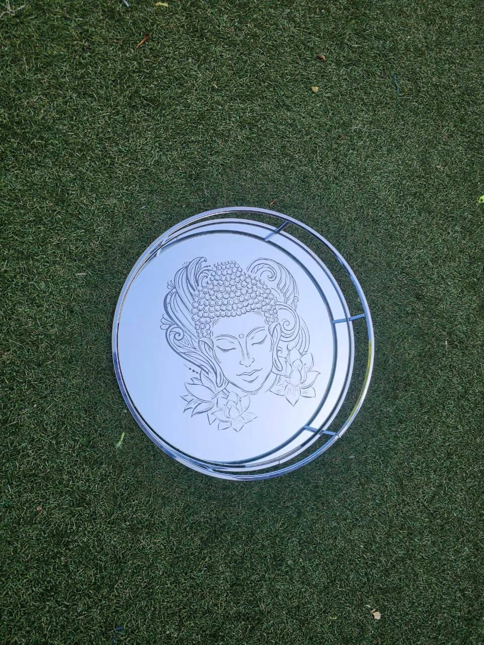 Mirror Vanity Tray Boddha design 30cm round with detailed Buddha engraving on a sleek mirrored base.