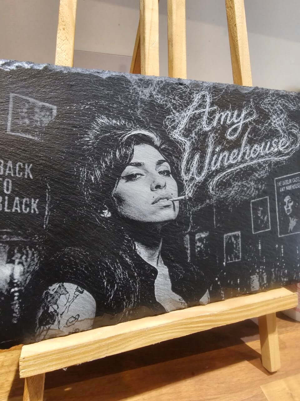 Amy Winehouse Back to Black Engraved Slate Plaque HandmadeUK on display, featuring a vintage-style portrait of Amy Winehouse.