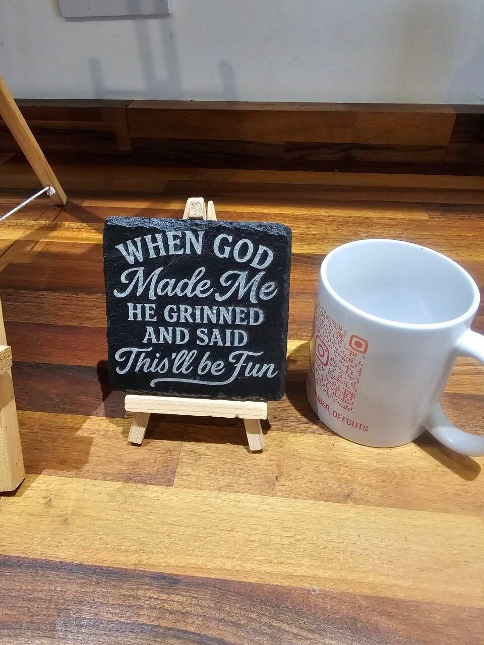 30cm x 20cm Premium Engraved Slate Plaque – “When God Made Me…” displayed on an easel next to a coffee mug.