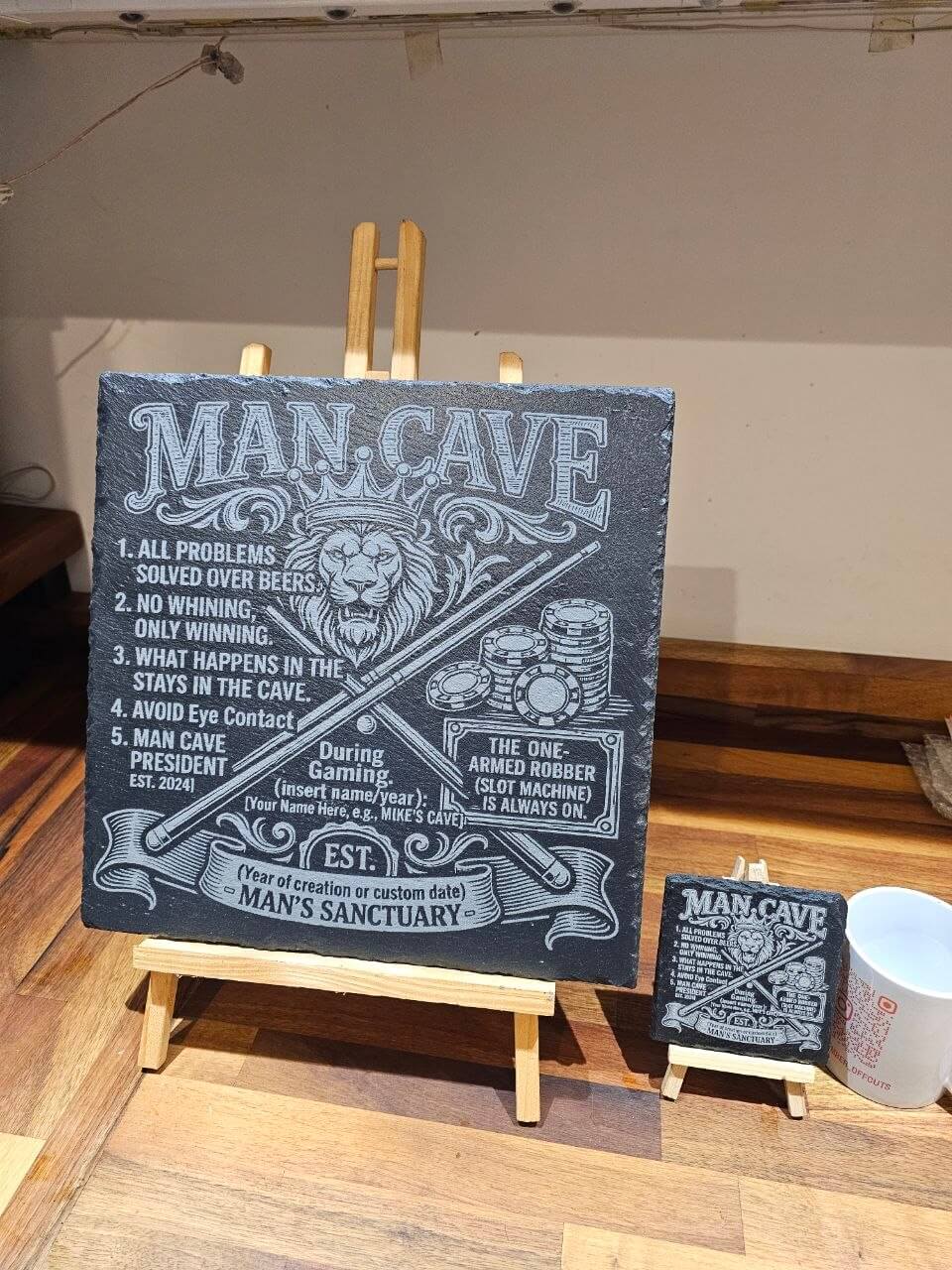 Personalised man cave slate plaque showcasing humorous rules and designs for a man cave setup.