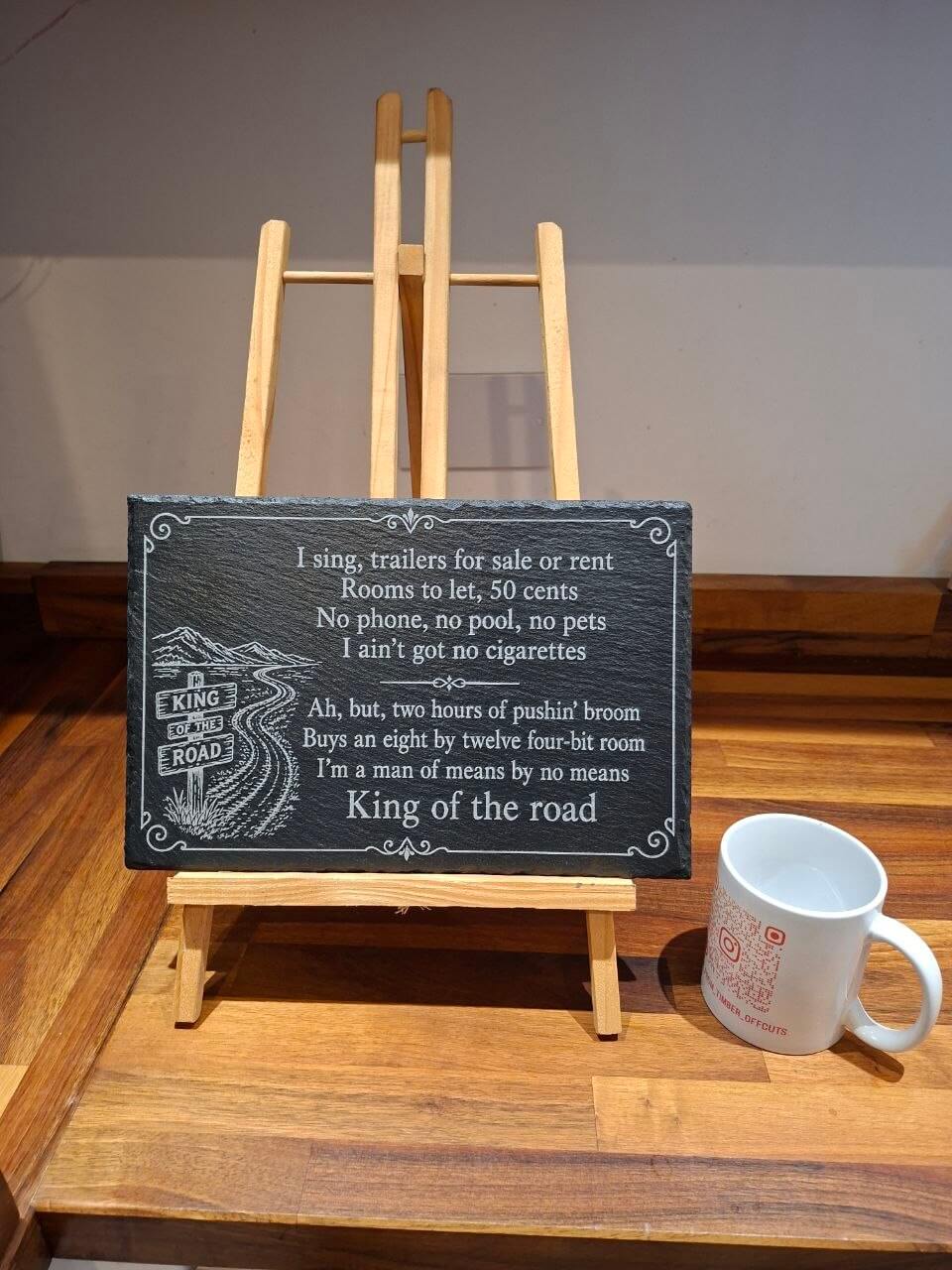 King of the Road Memorial Slate Plaque displayed on an easel with song lyrics beautifully engraved.