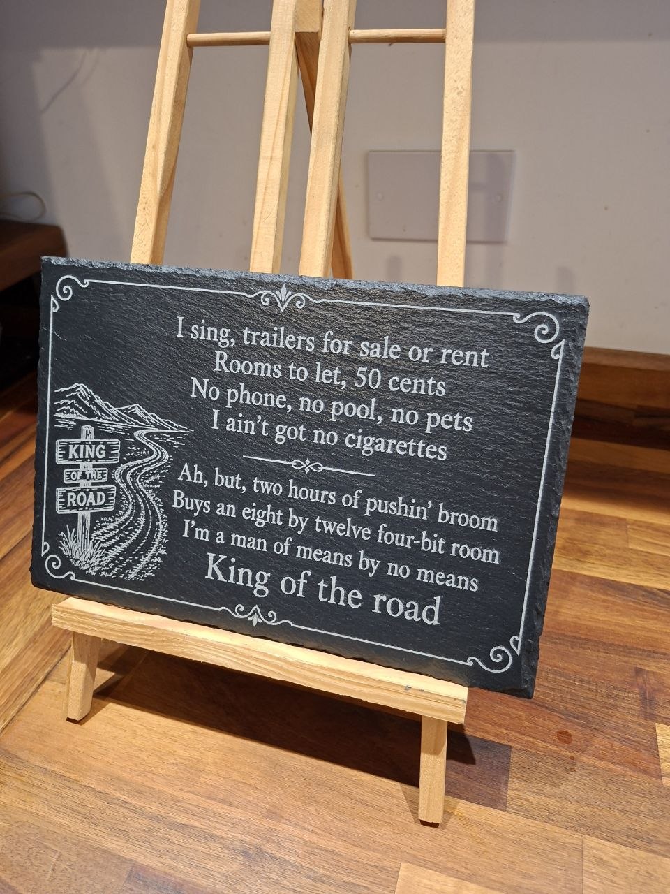 King of the Road Memorial Slate Plaque with engraved lyrics displayed on an easel.